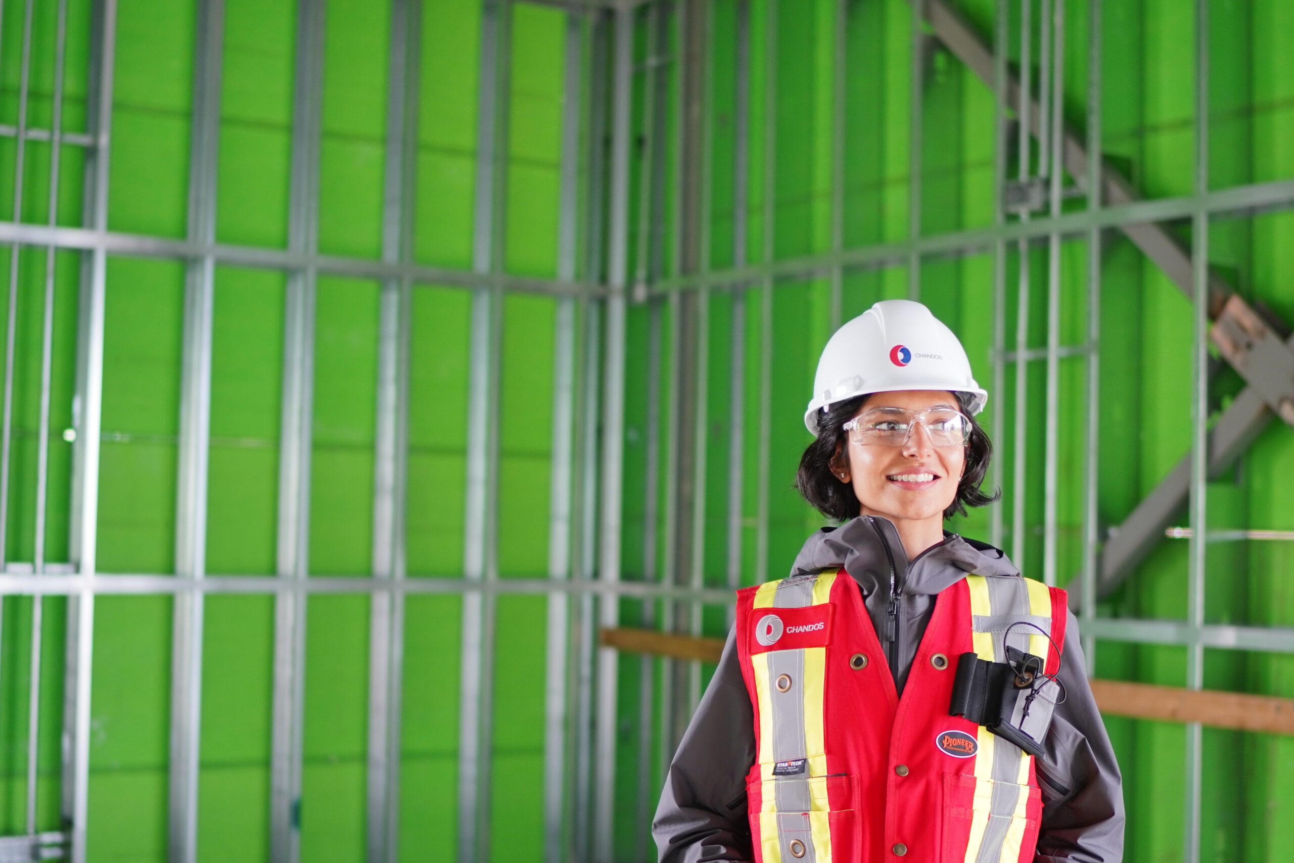 Chandos Construction is a purpose business committed to social procurement as a powerful tool to shape healthy communities and create impact. This includes diversity in their supply chain and hiring as pictured by the female construction worker in the image.